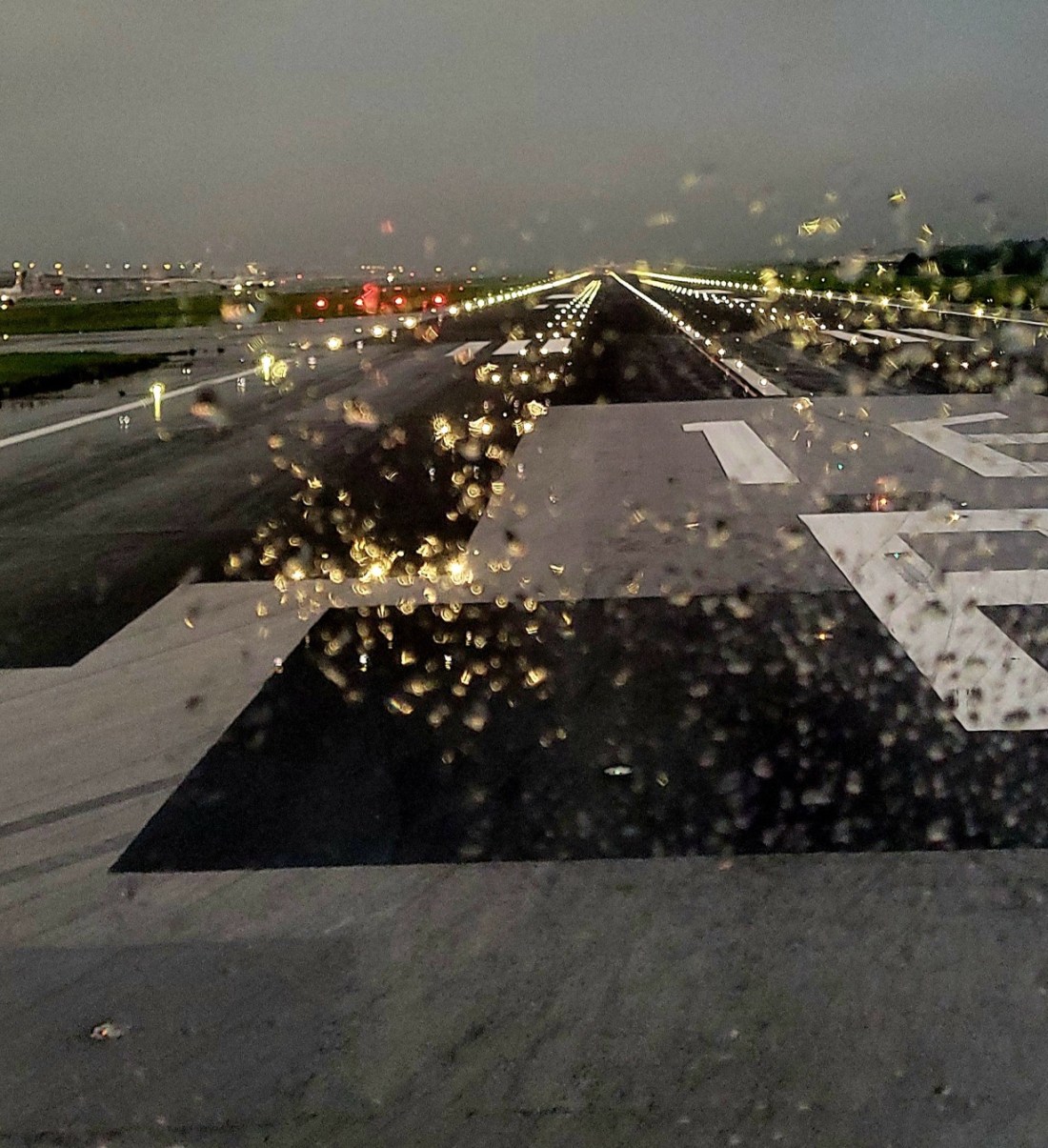 View of an airport runway at night.